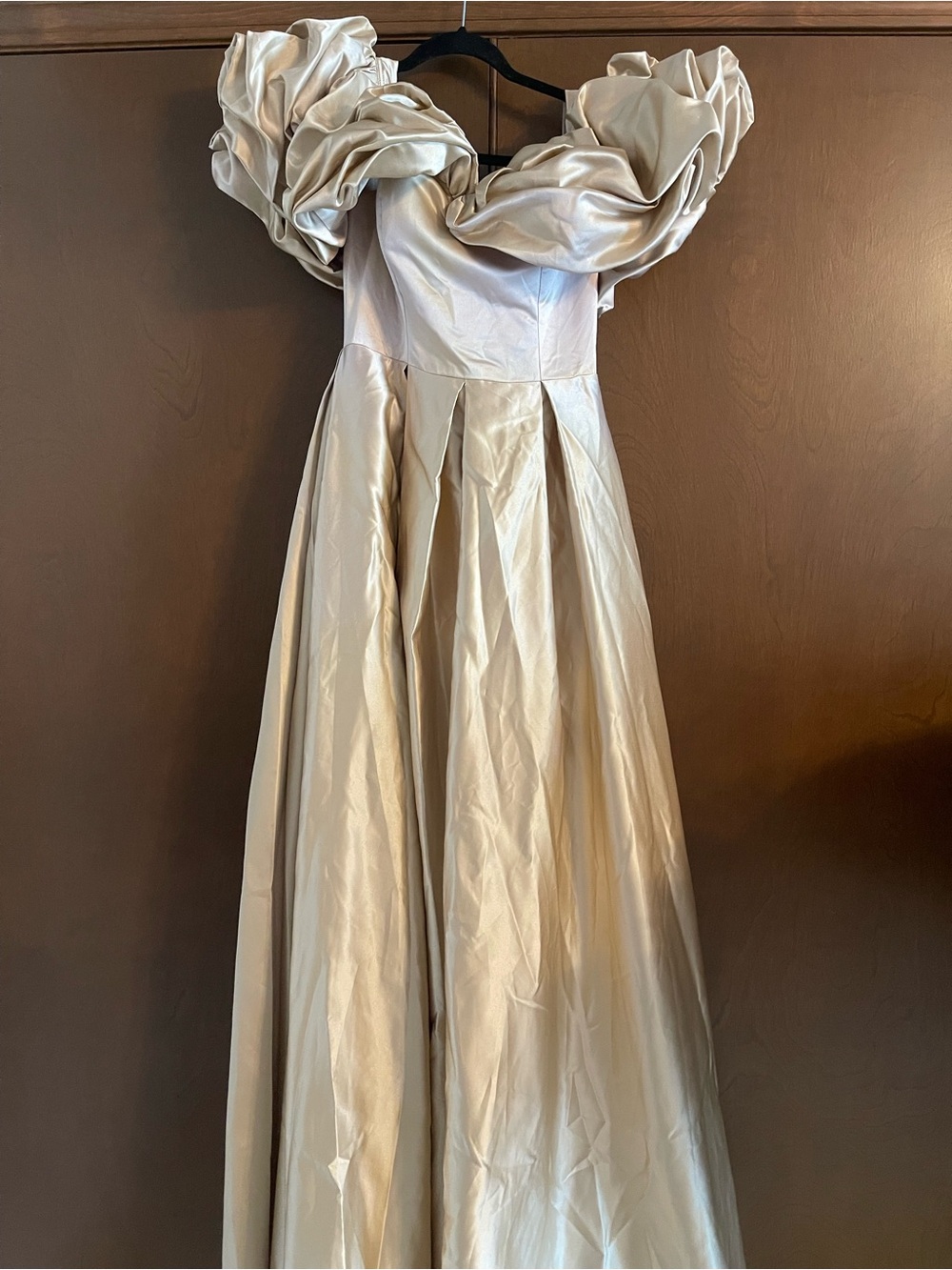 Elegant Ivory Satin Gown with Dramatic Ruffled Off-Shoulder Neckline